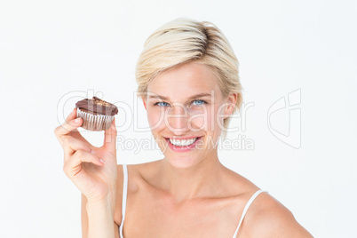 Pretty blonde holding chocolate muffin