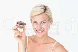 Pretty blonde holding chocolate muffin