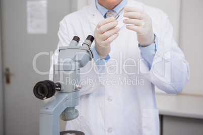 Scientist examining slide