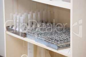 Tray with test tubes at the shelf