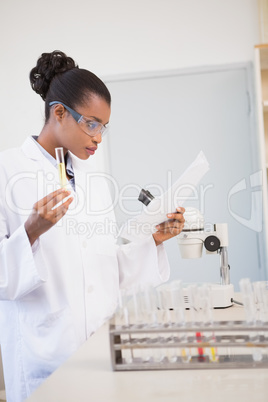 Scientist reading paper