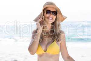 Smiling pretty blonde wearing sun glasses