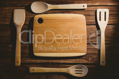 Chopping board with wooden utensils