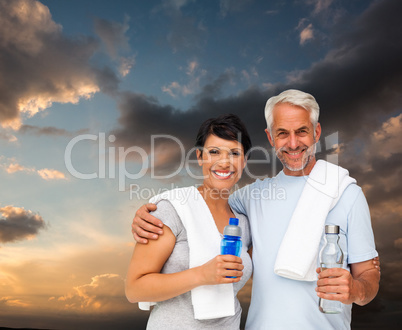 Composite image of portrait of a happy fit couple