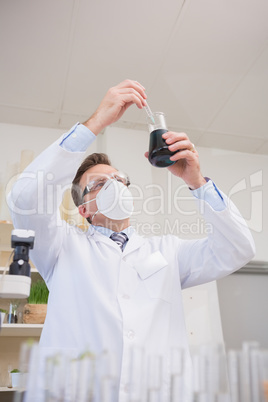 Scientist doing experimentations in flask