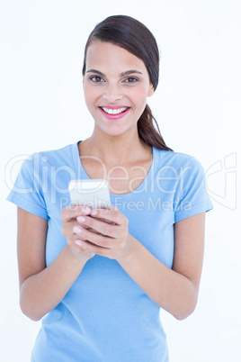 Happy brunette looking at her smartphone