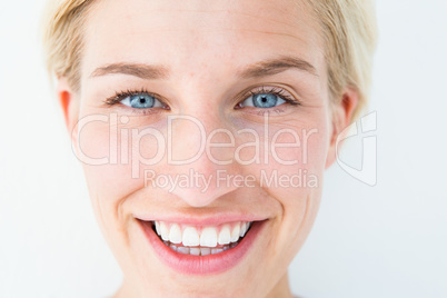 Happy blonde smiling at camera