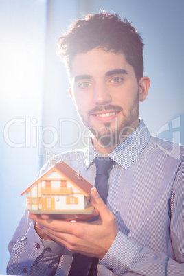 Businessman showing a key