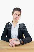 Businesswoman using her smart watch