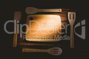 Chopping board with wooden utensils