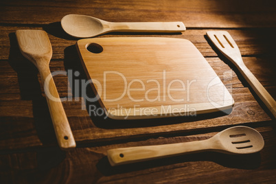 Chopping board with wooden utensils