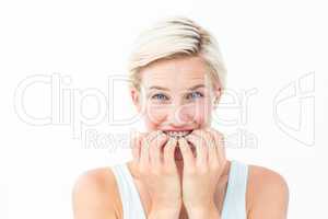 Nervous woman biting her nails looking at camera