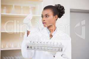 Scientist analyzing test tubes