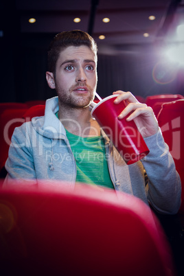 Young man watching a film