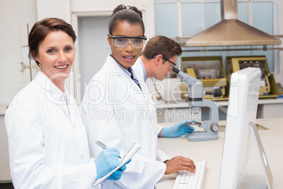 Smiling scientists working together