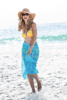 Smiling pretty blonde posing with sarong