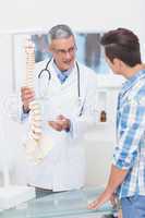 Doctor explaining the spine to his patient