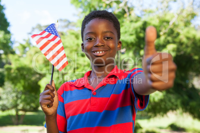 Little boy waving american flag