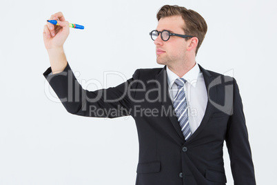Geeky businessman writing with marker Geeky businessman writing with marker