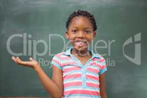 Smiling pupil raising her hand