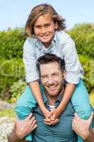 Father and son smiling at camera