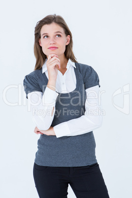 Thoughtful blonde woman with hand on chin