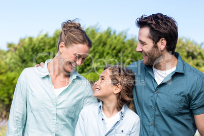 Happy family smiling at each other