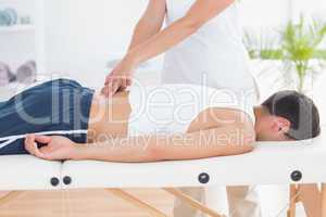 Physiotherapist doing back massage