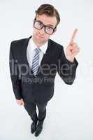 Geeky hipster businessman with finger up