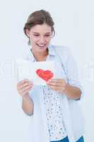 Smiling woman reading love letter