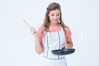 Hipster woman holding frying pan