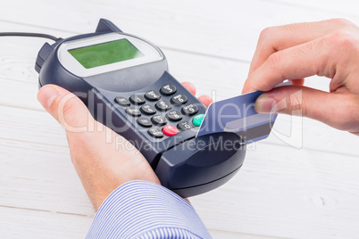 Man swiping his credit card