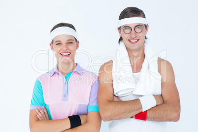 Geeky hipster couple posing in sportswear