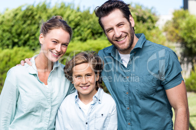 Happy family smiling at camera