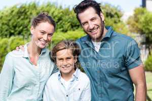 Happy family smiling at camera