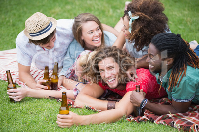 Hipster friends drinking beer and laughing