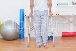 Patient standing with crutch