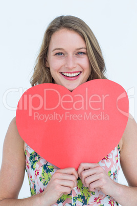 Woman holding heart card