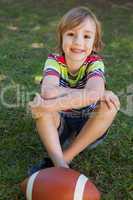 Little boy with american football