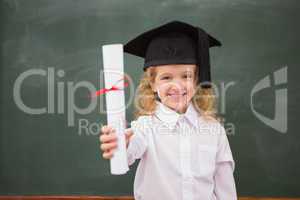 Pupil with graduation hat and holding her diploma