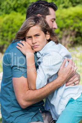 Father and son hugging