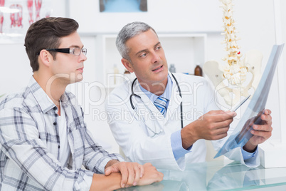 Doctor showing Xrays to his patient