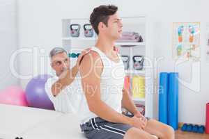 Doctor examining his patient back