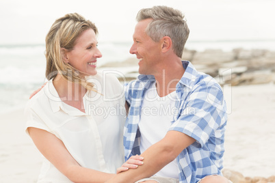 Casual couple smiling at each other