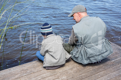 Father and son fishing together