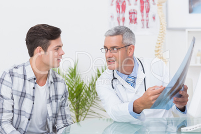 Doctor showing Xrays to his patient