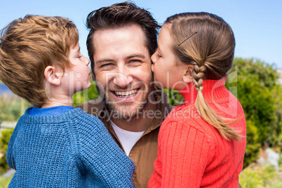 Happy father smiling at camera