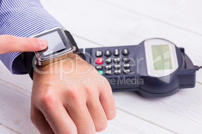 Man using smart watch to express pay