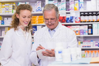 Pharmacists writing a prescription