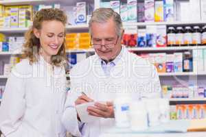 Pharmacists writing a prescription
